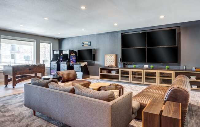 a living room filled with furniture and a large flat screen tv