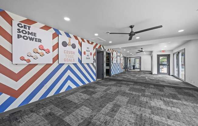 A hallway with a motivational poster on the wall.