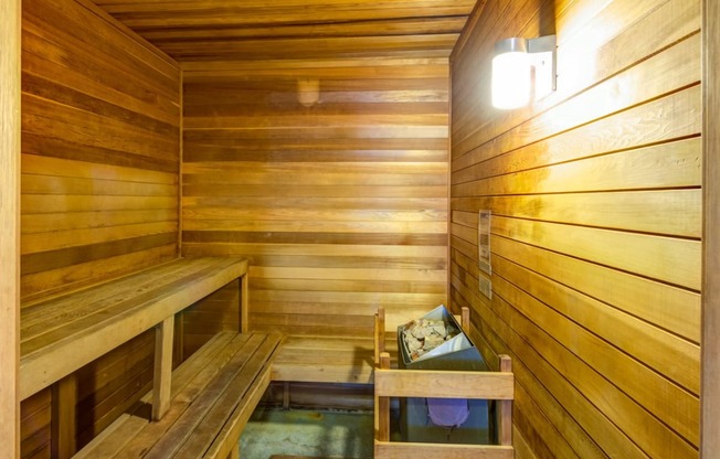 a large sauna with a bench and a table