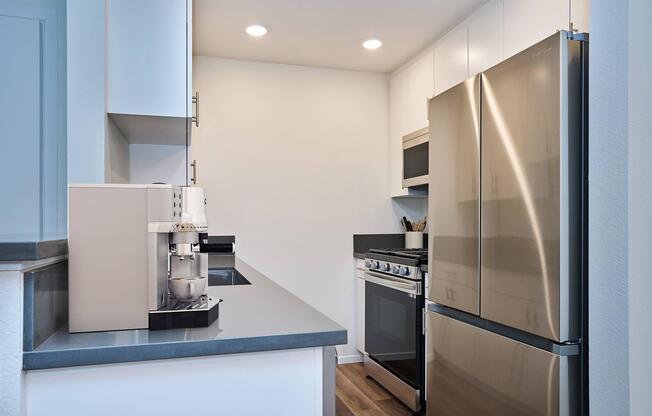 a kitchen with a sink and a refrigerator