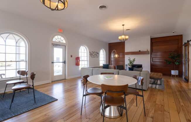 an open living room and dining room with a table and chairs