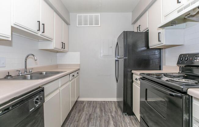 a kitchen with a stove and a sink