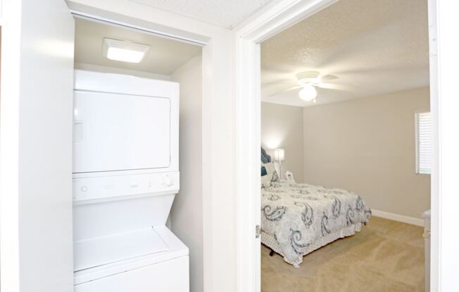 a bedroom with a closet and a laundry room with a bed at Granite Bay, Phoenix, Arizona, 85023