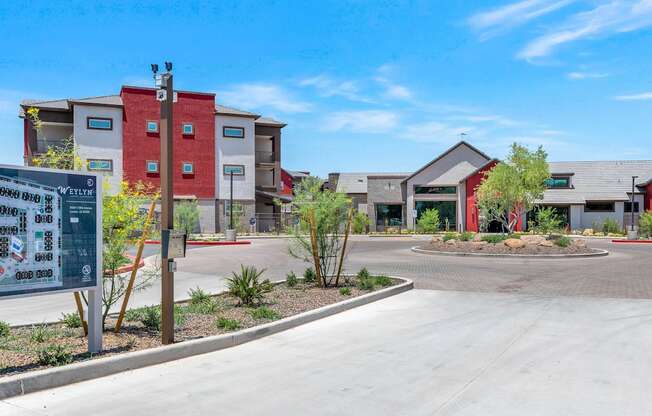 an empty parking lot in front of a building with apartments in the background at Weylyn Luxury Apartments, Laveen, AZ, 85339