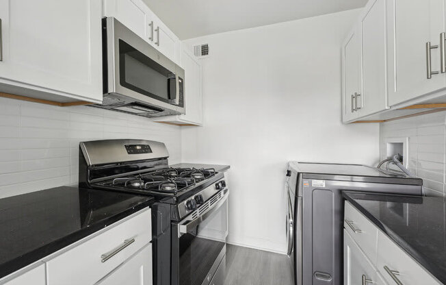 A Kitchen With a Microwave at Ashlawn at Southern Towers, Alexandria