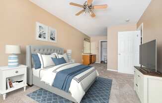 a bedroom with a bed and a ceiling fan