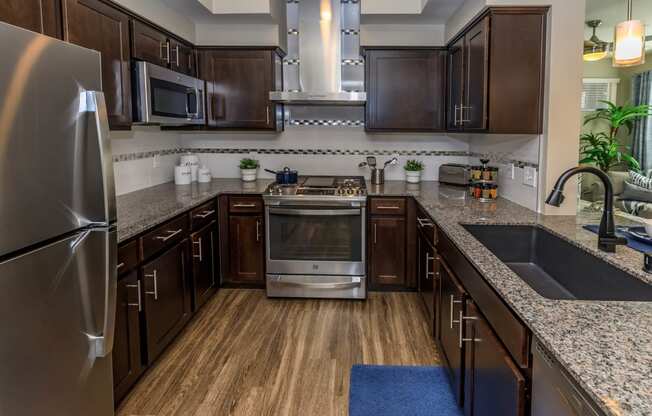 Kitchen with wooden cabinets1 at Level 25 at Sunset by Picerne, Nevada, 89113