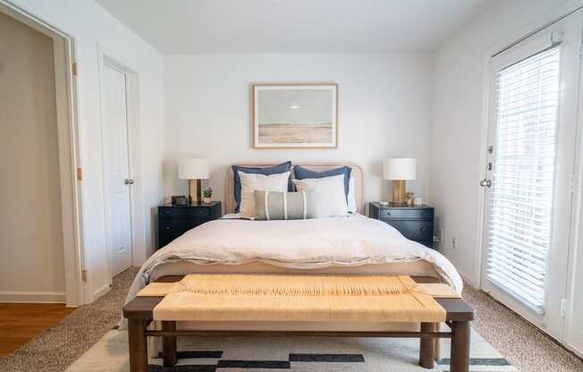 a bedroom with a bed and a coffee table
