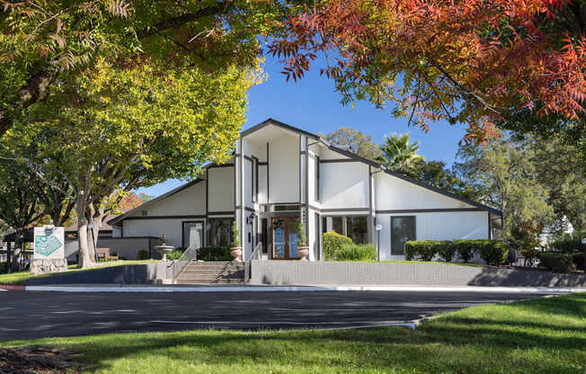A modern house with a white exterior and a large front porch.
