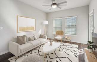 a living room with a white couch and a white coffee table