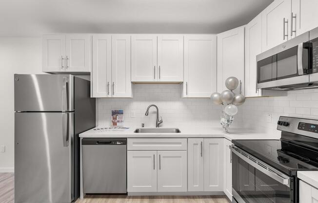 a kitchen with a stove and a refrigerator