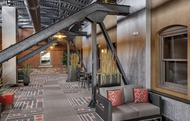 a lobby with a seating area and a staircase at The Knights @ 506 Delaware Apartments, Buffalo