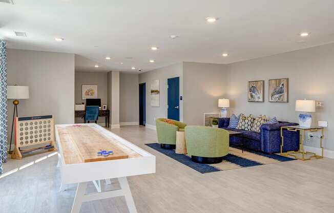 Resident lounge with games area at Central Island Square, Daniel Island, SC