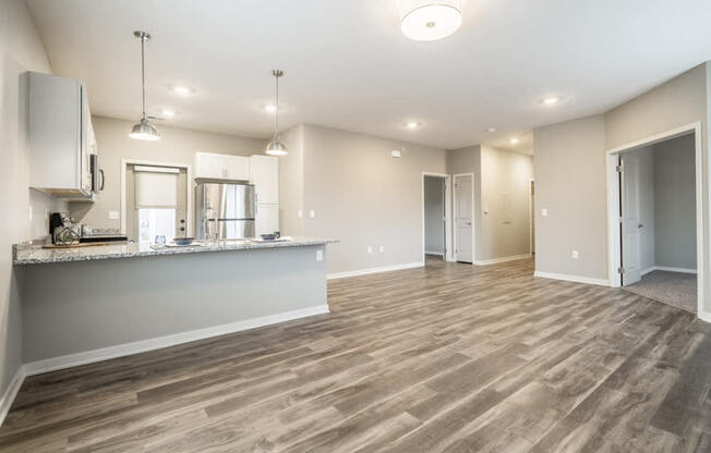 Interiors-Contemporary design scheme showcasing open layout with living room and kitchen at The Villas at Falling Waters