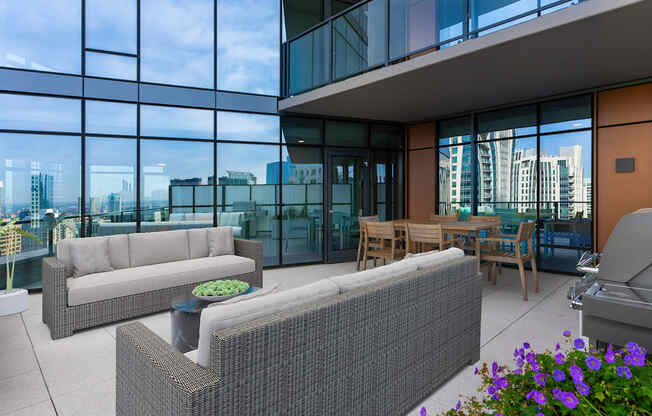 a living room with couches and a table in front of glass walls at Cassidy on Canal, Illinois, 60606