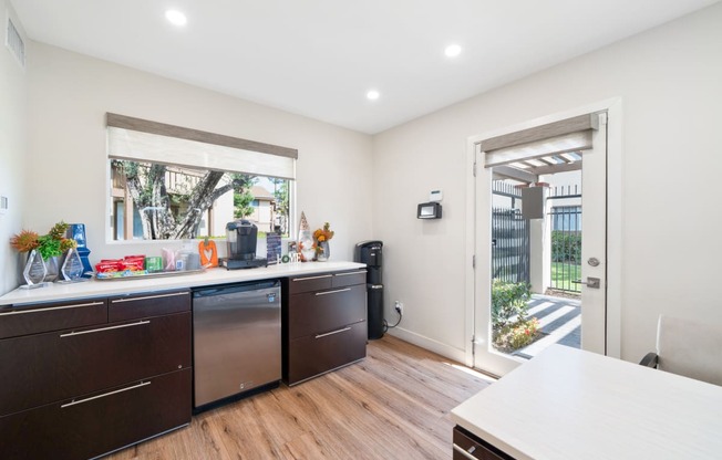 a kitchen with a counter and a door to a patio