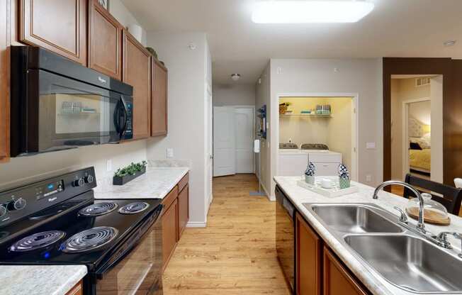 a kitchen with wood cabinets and white countertops