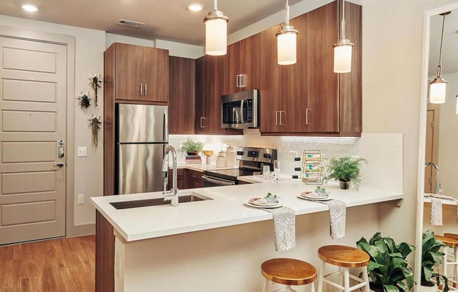 Dark Cabinetry in U Shaped Kitchen