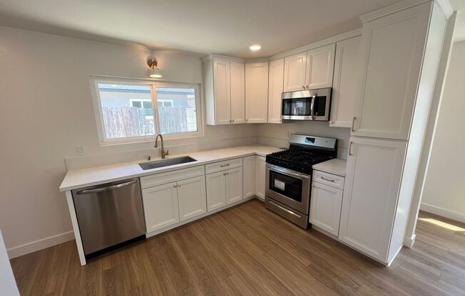 **Newly Renovated 2BDRM/1BTH with in unit laundry, private backyard and two parking spots!!**