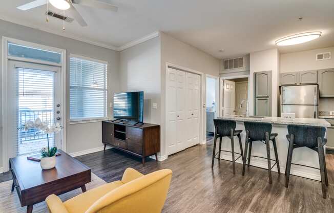 a room with chairs and tables in it and a pink and purple