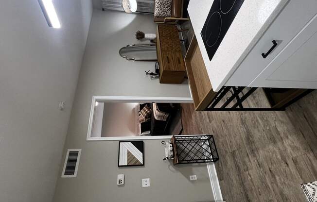 an overhead view of a kitchen and living room with a washer and dryer