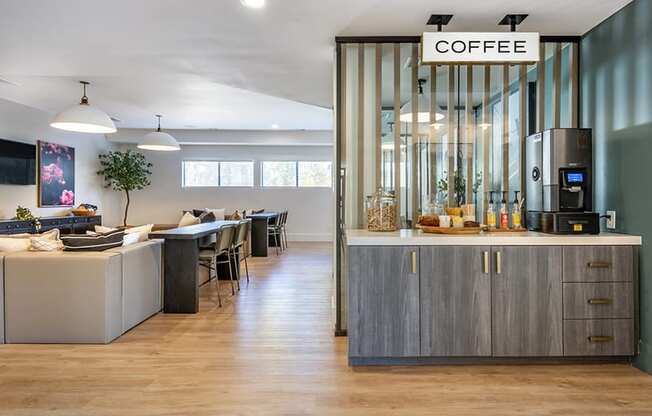 the lobby of a coffee shop with a counter and a coffee machine