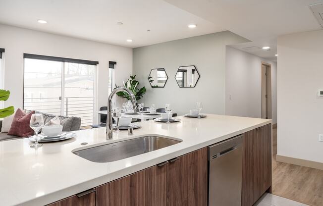 a kitchen with a sink and a counter top