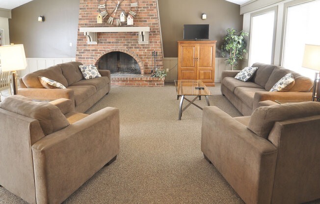 Quaint Fireplace Sitting Area In Clubroom at West Wind Apartments, Indiana, 46808