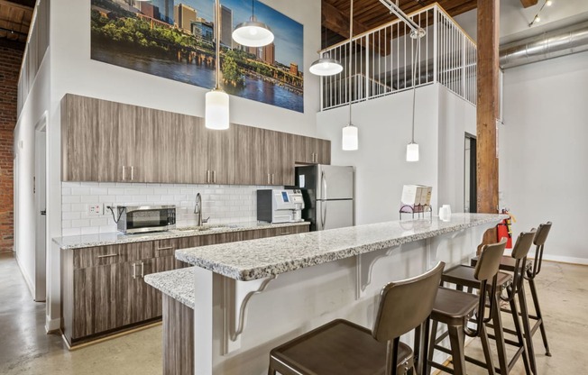 a kitchen with a long counter and stools