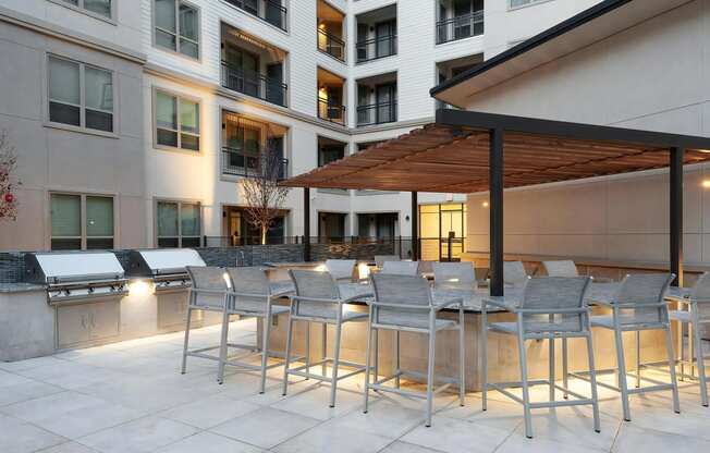 Courtyard Kitchen with Grills and Island Seating