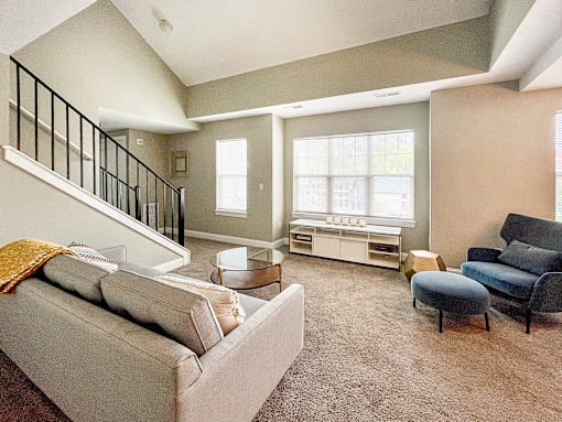 2-story loft apartment great room living area with large, bright windows
