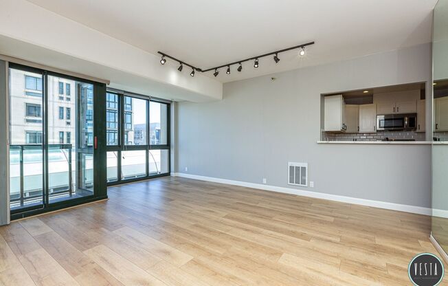 CATHEDRAL HILL: LIGHT FILLED CONDO IN FULL-SERVICE BUILDING W/ IN-UNIT WASHER/DRYER & PARKING INCLUDED