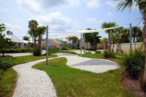 Thumbnail 6 of 20 - Walking paths and shaded areas at Coral Club, Bradenton, Florida