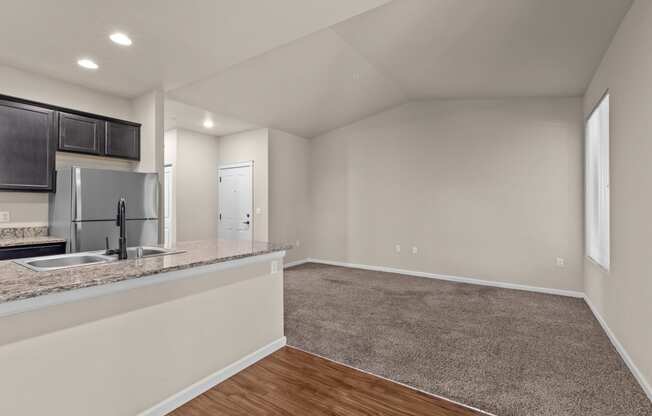 Little Tuscany Apartments & Townhomes - Apartment Living Room, Dining Room, Kitchen, and Breakfast Bar View