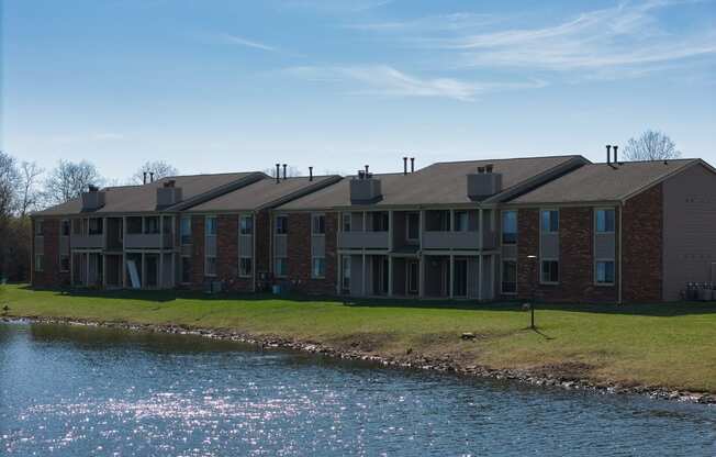 an apartment building overlooking a body of water