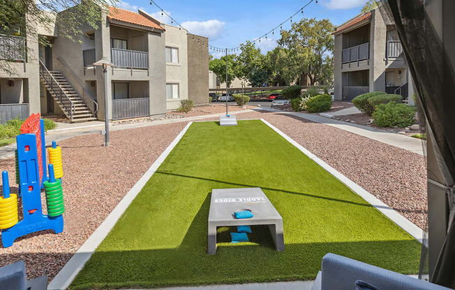 Outdoor Corn Hole Area at Saddle Ridge Apartments in Tucson, AZ.