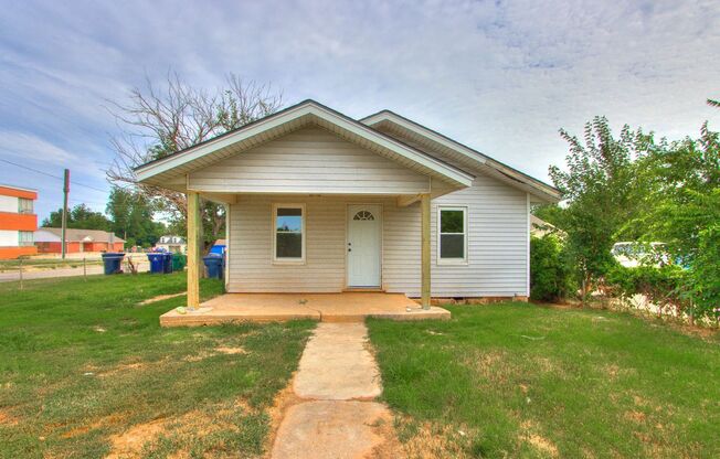 Stylishly Remodeled 2-Bedroom Home with Spacious Fenced Backyard and Gorgeous Green Kitchen Cabinets!