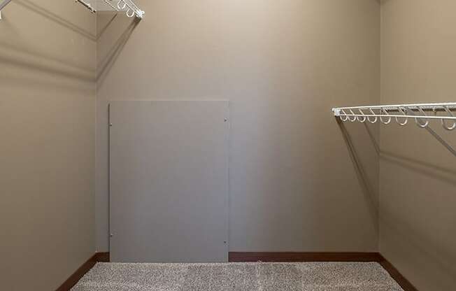 Interiors- Big walk-in closet for clothing and extra storage at the Villas of Omaha Butler Ridge in Omaha NE