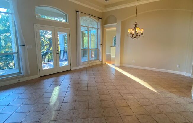 BEAUTIFUL CUSTOM ONE STORY HOME WITH WROUGHT IRON GATE COURTYARD ENTRY.