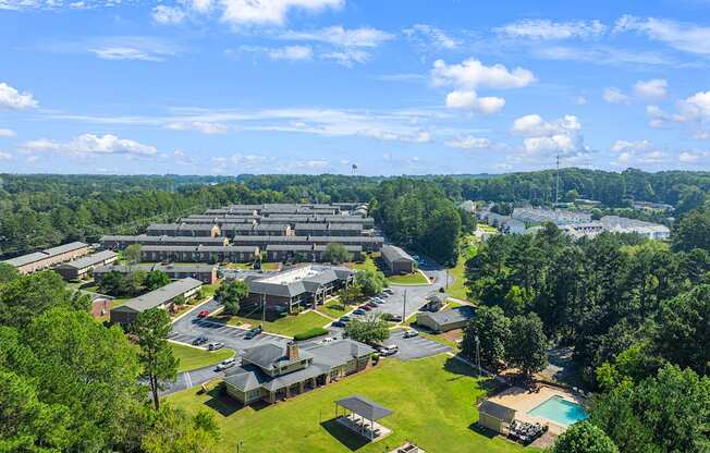 an aerial view of a campus with trees and buildings