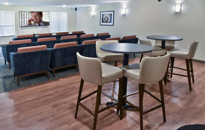 Theater Room with Stadium Seating and Tall Tables