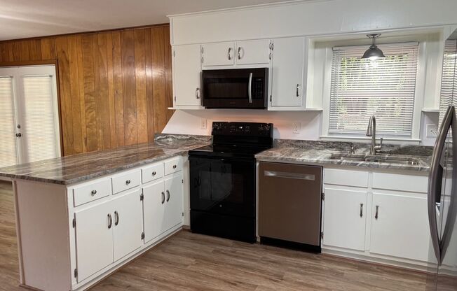 Nice brick home, single carport, storage building, 3 bdrm 1.5 ba