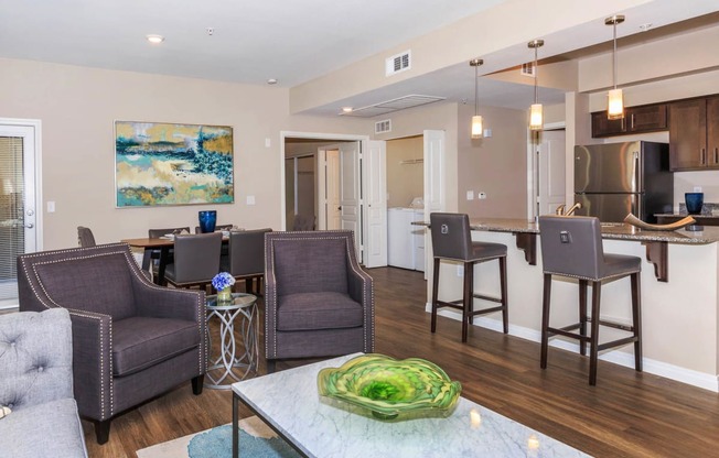 Breakfast bar in kitchen near living at Level 25 at Durango by Picerne, Las Vegas, NV