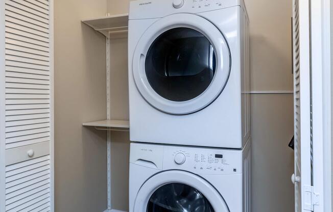 a washer and dryer next to a window