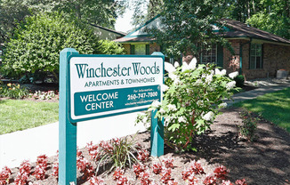 a sign that says winchester woods apartments and townhomes
