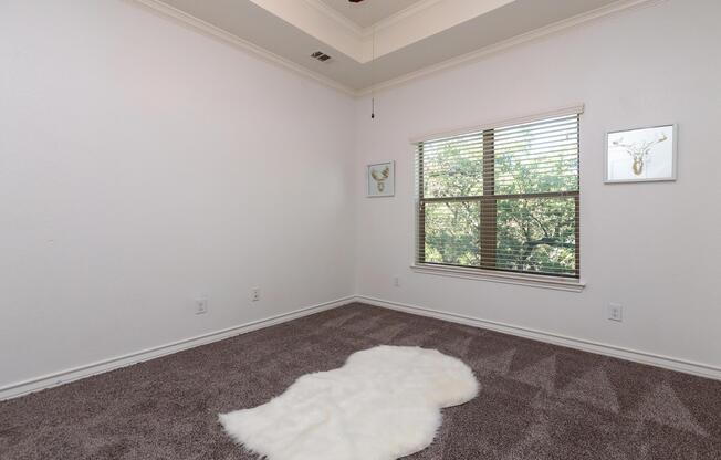 a bedroom with a large window