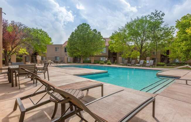the reserve at city center apartments swimming pool and tables