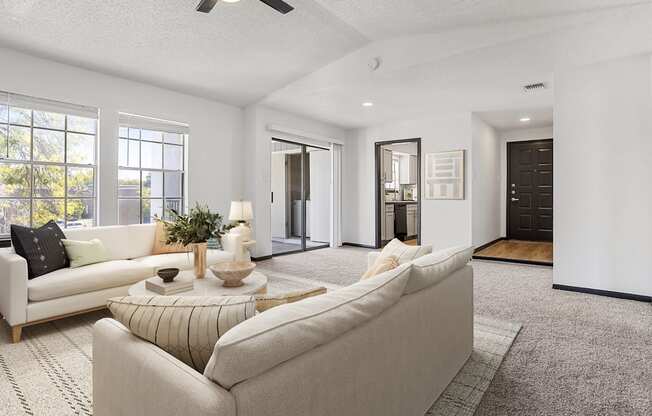 a living room with couches and a coffee table