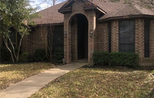 Beautifully maintained custom home on a clean and neat tree lined street