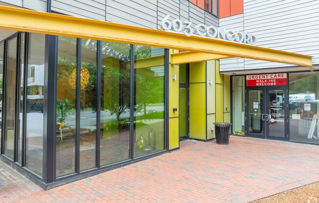 The front of a building with a red sign that says  at 603 Concord Apartments, Cambridge, Massachusetts